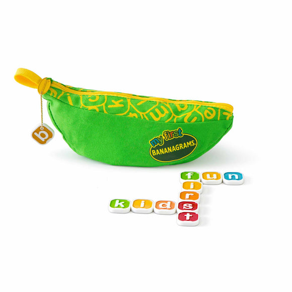 A colorful green pouch in the shape of a banana labeled 'My First Bananagrams' from Bananagrams. The pouch is unzipped, revealing several letter tiles arranged to spell 'fun', 'first', and 'kids'. The pouch features a bright yellow zipper and a playful design, making it appealing for children and families.