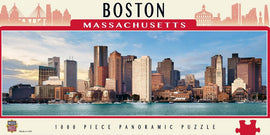 A panoramic view of the Boston skyline featured in a 1000 piece jigsaw puzzle by MasterPieces. The image showcases iconic skyscrapers and buildings along the waterfront, capturing the essence of Boston, Massachusetts with clear skies and vibrant colors.