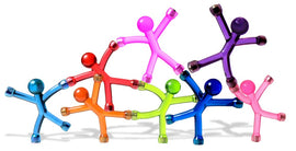 A colorful assortment of translucent plastic figures in various poses, showcasing their vibrant sea blue, pink, green, red, and yellow hues. This playful arrangement highlights the Mini QMan figures, emphasizing their fun and versatile design, perfect for both play and display.