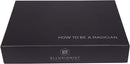 The 'How To Be A Magician' boxset by US Playing Card Co. features a sleek black exterior with the title printed in white letters. The Ellusionist logo is visible at the bottom, representing quality magic training resources for aspiring magicians.