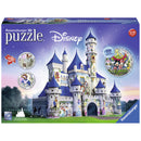 Ravensburger Disney Castle 3D puzzle packaging, featuring an intricately designed castle with blue spires and characters from Disney. The box displays vibrant imagery and highlights that it includes 216 pieces, suitable for ages 12 to 99.