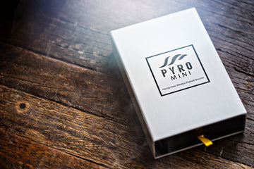 The Pyro Mini V4 Bundle by ELusionist features a sleek white box with a bold black logo. The package includes a hands-free wireless fireball shooter, ideal for magicians and performers looking to enhance their acts with stunning visual effects.