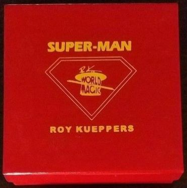 A bright red box featuring the Superman logo with the text 'SUPER-MAN' and 'ROY KUEPPERS' below it. The box also includes the logo of 'RK WORLD MAGIC,' indicating it’s a magic-related product.
