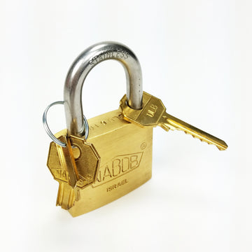DanLock mechanical puzzle by Puzzlocks, featuring a shiny brass padlock with a stainless steel shackle. The padlock is accompanied by two decorative keys on a keyring. This intricate design challenges users to unlock the mechanism, promoting problem-solving skills and logical thinking.