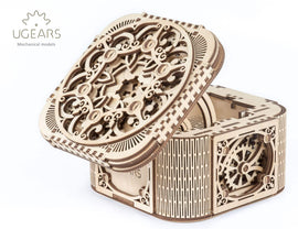 The UGears 3D Treasure Box is an intricately designed mechanical DIY kit made of high-quality wood. It features ornate engravings on the lid and sides, showcasing delicate patterns and gears visible inside the box. The treasure box can be assembled without glue, providing an engaging building experience for enthusiasts of all ages.