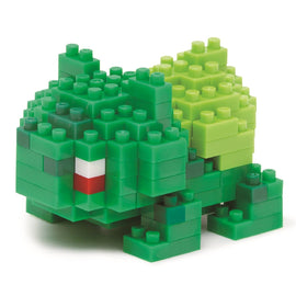A vibrant Nanoblock DIY kit featuring a buildable Bulbasaur character. Constructed from small colorful building blocks, the completed model showcases intricate details including bright green and yellow hues, enhancing its lifelike appearance. Perfect for fans of all ages, this kit offers a creative and engaging building experience.