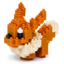 A colorful Nanoblock DIY kit featuring Eevee, a charming brown and cream Pokémon character crafted with small, interlocking building blocks. The design captures Eevee's playful expression and fluffy tail, perfect for collectors and enthusiasts of all ages.