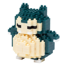 A detailed build of a Snorlax figure made from small interlocking blocks. The figure showcases shades of teal and cream, with distinct features like its closed eyes, mouth, and round belly. The playful design captures Snorlax's character, making it an enjoyable craft project suitable for fans and collectors.