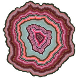 A vibrant jigsaw puzzle shaped like an agate slice, showcasing a stunning array of colors including pink, teal, and brown, with a smooth, layered pattern resembling natural stone.