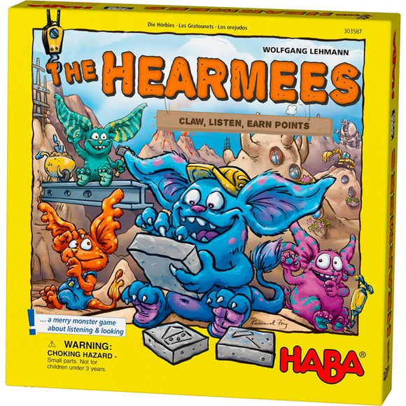 The Hearmees board game by HABA features colorful monster characters engaging in a playful scene. The box highlights the game's objective: claw, listen, and earn points, inviting players to enjoy a fun and interactive experience.