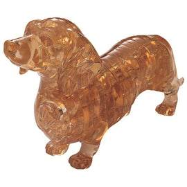 A 3D crystal jigsaw puzzle of a Dachshund, featuring intricate layering and a glossy amber finish. The puzzle pieces fit together to form a lifelike, three-dimensional representation of the beloved dog breed. Ideal for both puzzle enthusiasts and dog lovers, this decorative piece showcases craftsmanship and creativity.