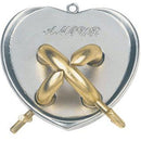 The Cast Amour mechanical puzzle by Hanayama features a heart-shaped design with intricate golden and silver interlocking pieces. The word 'AMOUR' is elegantly engraved on the surface, highlighting its romantic theme. Two key components are visible on the sides, indicating how the pieces interact in this challenging puzzle.