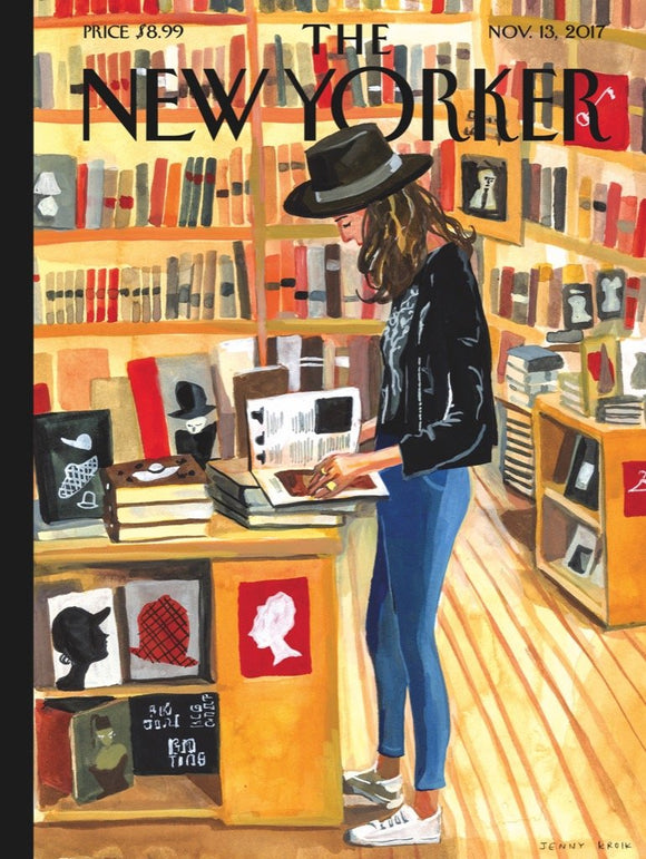 At the Strand Puzzle, a 1000-piece jigsaw puzzle featuring an illustration of a woman browsing in a bookstore with shelves filled with books in the background. The design captures a cozy literary atmosphere, ideal for puzzle enthusiasts and lovers of literature.