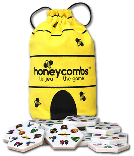 A bright yellow bag featuring a bee design, labeled 'honeycombs the game,' with hexagonal game pieces scattered around it. The pieces display colorful illustrations of animals and numbers, suitable for family game nights.