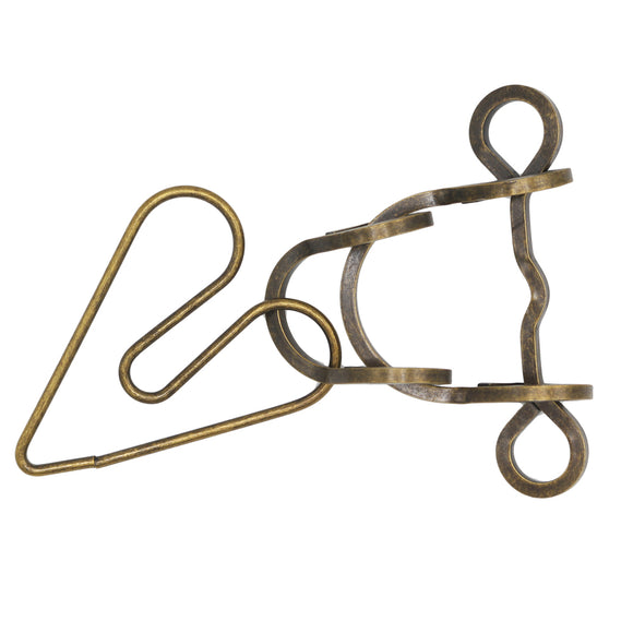 Heart Attack Mechanical puzzle by Eureka Puzzles, featuring intricate metal components designed for engagement. The puzzle includes several interlocking pieces, requiring strategic manipulation for completion, resembling a complex, vintage-style design.