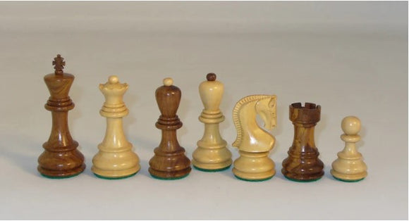 A collection of 3.75-inch Kikkerwood chess pieces from WorldWise Imports, featuring a king, queen, bishop, knight, rook, and pawn. The pieces have opposite tops in contrasting colors and a felt base for smooth movement on the chessboard.