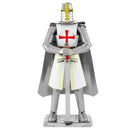 ICONX: Templar Knight DIY kit by Fascinations showcasing a detailed metallic model of a medieval knight wearing armor adorned with a red cross, helding a sword, and standing on a base.