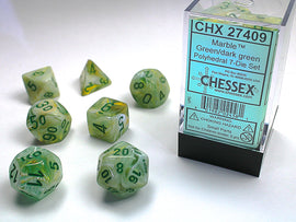Chessex Marble Green/Dark Green Polyhedral 7-Die Set featuring various shapes including a d20, d12, d10, d8, d6, d4, and a d percentile die. The dice are translucent with a marbled green appearance and black numbers, packaged in a clear box.