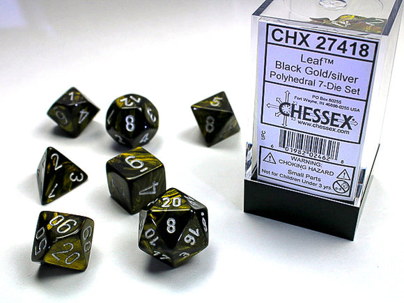 Chessex Leaf Black Gold/Silver Polyhedral 7-Dice Set featuring seven colorful dice in black with gold and silver numbers. Ideal for tabletop games and RPG enthusiasts, showcasing a stylish design.