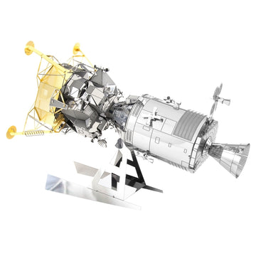 A detailed DIY model kit of the Apollo Command/Service Module (CSM) with Lunar Module (LM) by Fascinations. The model displays intricate metal pieces, featuring a shiny silver finish and golden highlights on the Lunar Module, showcasing the engineering marvel of space exploration.