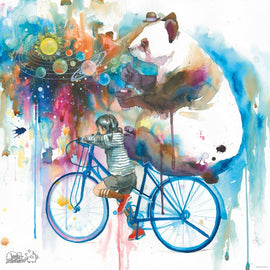 A colorful jigsaw puzzle titled 'Universe Creator' by Heye, featuring a whimsical watercolor illustration of a girl on a blue bicycle accompanied by a giant panda. The background bursts with vibrant colors and celestial elements like planets and bubbles, creating a dreamy and imaginative scene.