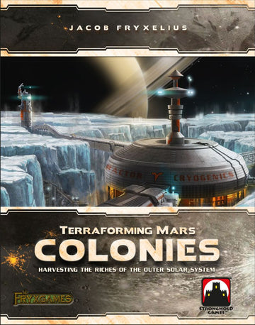 Front cover of the board game 'Terraforming Mars: Colonies' by Stronghold Games. The artwork features a futuristic colony on an icy landscape, highlighting a domed structure with a cryogenics label and technological towers, all set against a backdrop of a distant planet and starry sky. The title 'Terraforming Mars: Colonies' and the subtitle 'Harvesting the Riches of the Outer Solar System' are prominently displayed.