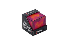 Shashibo Optical Illusion is a vibrant mechanical puzzle featuring a colorful design. The puzzle comes in a cube shape and invites users to create over 70 unique shapes with its innovative design. The packaging displays an intriguing optical illusion pattern, promoting creativity and fine motor skills in a tactile experience.