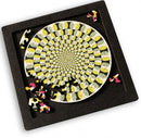 Curiosi Puzzle Tray Large featuring a colorful jigsaw puzzle with a spiral design. The tray is black with several puzzle pieces scattered around the incomplete puzzle, showcasing intricate patterns in vibrant colors including yellow, pink, and black.
