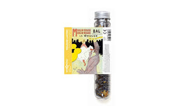 Micropuzzle La Goulue by Londji, featuring a vibrant design inspired by the Moulin Rouge. The puzzle comes in a glass tube, showcasing various intricately shaped puzzle pieces ready for assembly. The artwork depicts a lively scene with bold colors and expressive characters, perfect for puzzle enthusiasts and collectors.