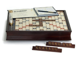 Scrabble Deluxe Classic Edition board game by Winning Solutions. The image features a beautifully crafted wooden game board with a grid layout for letter placement, a timer, a score sheet, and letter tiles displaying 'WORD-FUN' and 'CLASSIC'. Perfect for family game nights and word enthusiasts.