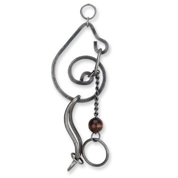 The Traveler's Woe Tavern Puzzle by Tucker Jones House is an intricate mechanical puzzle made of metal. It features a series of interlocking shapes and loops, with a chain and a bead adding to its complexity. The metallic finish and unique design make it both a challenge to solve and an attractive decorative piece.