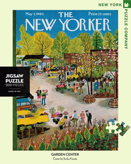 A colorful 500-piece jigsaw puzzle featuring a vibrant scene of a garden center illustrated by Ilonka Karasz, depicting people shopping for plants with various stalls and greenery in the background. The puzzle is packaged with the New Yorker cover image dated May 7, 1960.