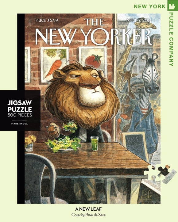 A 500-piece jigsaw puzzle titled 'A New Leaf' featuring a whimsical illustration of a lion at a café table surrounded by vegetables and art on the walls. The puzzle is designed by Peter de Sève and made by New York Puzzle Company. The package includes a puzzle piece image on a light green background with the name of 'The New Yorker' magazine displayed at the top.