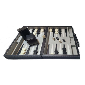 Leatherette backgammon game set featuring an 18-inch foldable board. The board displays alternating light and dark spaces, with black and white checkers, two dice, and a dice cup. Perfect for stylish gameplay and family fun.
