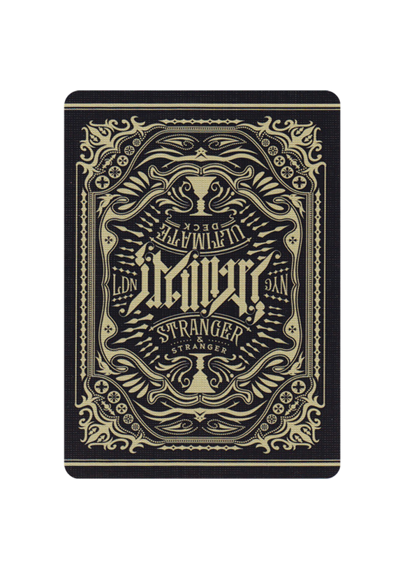 The Ultimate Deck - Stranger features an intricately designed back with a vintage artistic motif, showcasing ornamental elements and a bold typography. The card design is predominantly black and gold, creating a distinctive look suitable for magic tricks, card games, and collectors.