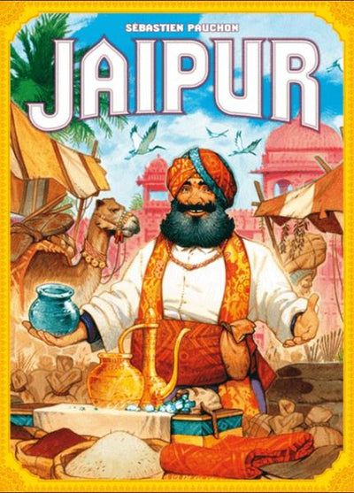 Jaipur (New Edition) board game by Space Cowboys featuring a colorful illustration of a smiling merchant with a turban, surrounded by vibrant market scenes, camels, and traditional Indian architecture. The game emphasizes trade and strategy, ideal for players who enjoy competitive gameplay.