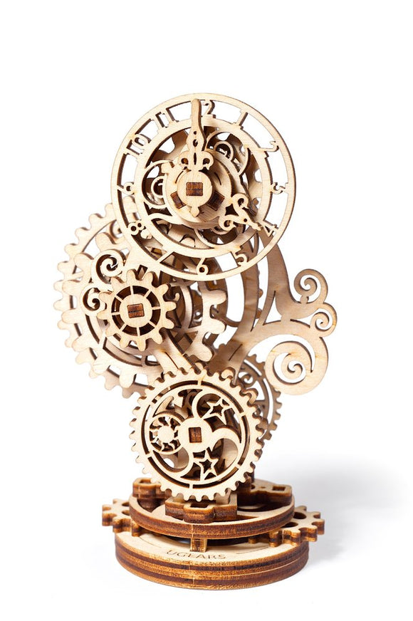 The UGears 3D Steampunk Clock is a beautifully crafted mechanical puzzle made of light wood. It features intricate gears and clock hands combining steampunk aesthetics with playful functionality. The design showcases swirling shapes and detailed carvings, offering an engaging DIY experience as users assemble this unique clockwork model.