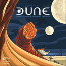 Dune board game by Gale Force Nine featuring striking artwork of a massive sandworm amidst a desert landscape. The game is designed for 2 to 6 players and revolves around themes of conquest, diplomacy, and betrayal, with the tagline 'The Spice Must Flow.'