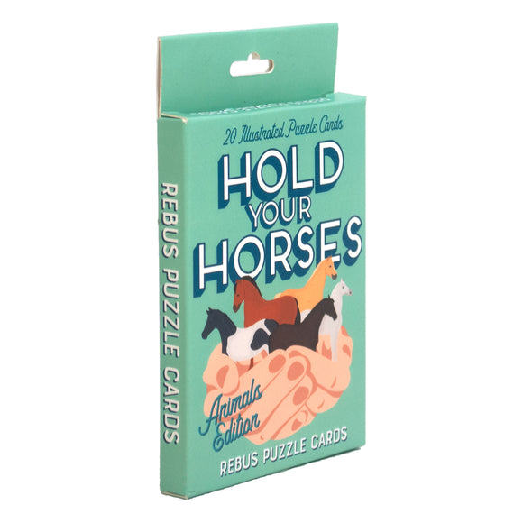 Hold Your Horses is a set of 20 illustrated rebus puzzle cards featuring images of various horses on the front. The packaging showcases colorful artwork with a hand holding the horses, and the title is prominently displayed in playful typography. The Animals Edition invites players to solve fun visual puzzles related to horses.
