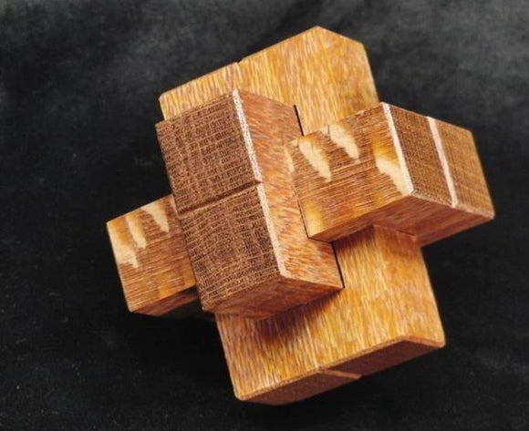 The Missing Notch is a well-crafted mechanical puzzle made of intricately assembled wooden pieces. It features a unique design with interlocking blocks, showcasing a mix of light and dark wood grains. Perfect for puzzle enthusiasts, this challenging brain teaser encourages critical thinking and problem-solving skills.