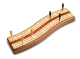 The Walnut S Curve Cribbage Board by Heartwood Creations is elegantly crafted from rich walnut wood. The board features a smooth, curvaceous design with various holes for pegs and two distinct tracks marked by inlaid wood, ensuring a classic gameplay experience. Perfect for family game nights or as a timeless gift.