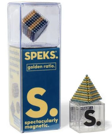 The Speks Stripes Golden Ratio is a set of magnetic spheres displayed in a clear packaging. It features a pyramid made from tiny spherical magnets that can be manipulated into various shapes and structures, emphasizing creativity and magnetism. The packaging has vibrant colors with the SPEKS logo and details about the product's features.