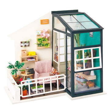 The Fancy Balcony Daydreaming Model Kit by Robotime features a beautifully designed miniature scene, showcasing a cozy sitting area with a plush pink chair, a small wooden table adorned with plants and books, and a balcony filled with greenery. The model includes intricate details like decorative shelves with vibrant flowers, a glassy structure allowing light to pour in, and a warm, inviting atmosphere perfect for daydreaming.