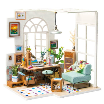 The SOHO Time DIY Miniature House Model Kit features a charming miniature room with a desk, chair, bookshelves, and decorative items. The scene includes plants, a cozy armchair, and artistic wall decor, perfect for hobbyists and collectors. This intricately designed DIY kit allows you to create an inviting living space filled with details.