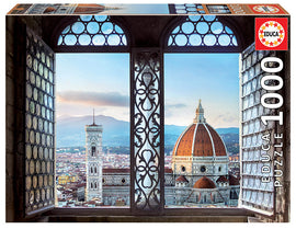 Educa VIEWS OF FLORENCE jigsaw puzzle featuring a stunning view of Florence, Italy, through ornate window frames. The puzzle has 1000 pieces and highlights iconic architecture, including the Cathedral of Santa Maria del Fiore and Giotto's Campanile against a beautiful sky.