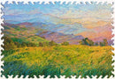 A vibrant jigsaw puzzle featuring a beautiful landscape titled 'Layers of Afternoon' by Erin Hansen. The artwork showcases rolling green hills, soft golden fields, and a colorful sky with shades of blue and orange melding into the horizon. The puzzle pieces have a wavy edge, emphasizing the artistry of the design, perfect for puzzle enthusiasts and nature lovers alike.