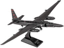 Metal Earth U-2 Dragon Lady model made from metal sheets, depicting a sleek black aircraft with elongated wings and detailed cockpit. The model features engraved markings and is displayed on a black stand with the name 'Lockheed U-2'.