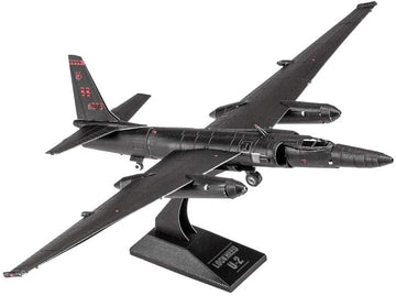 Metal Earth U-2 Dragon Lady model made from metal sheets, depicting a sleek black aircraft with elongated wings and detailed cockpit. The model features engraved markings and is displayed on a black stand with the name 'Lockheed U-2'.