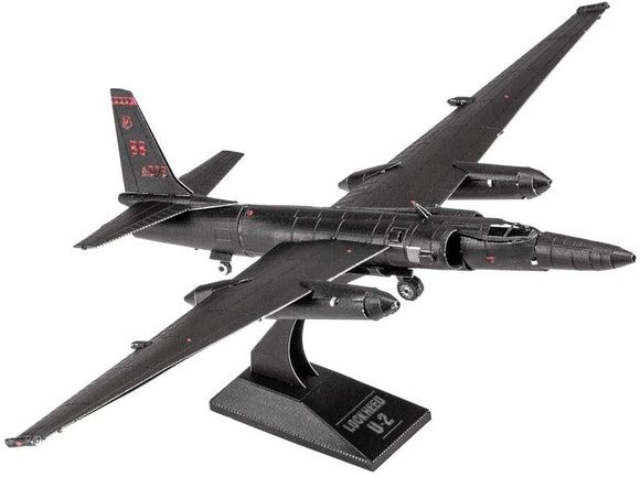 Metal Earth U-2 Dragon Lady model made from metal sheets, depicting a sleek black aircraft with elongated wings and detailed cockpit. The model features engraved markings and is displayed on a black stand with the name 'Lockheed U-2'.