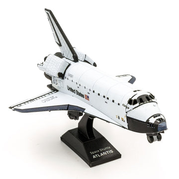 A detailed metal model of the Space Shuttle Atlantis from Fascinations. The shuttle features intricate designs, displaying its iconic shape and NASA insignia, mounted on a black base.